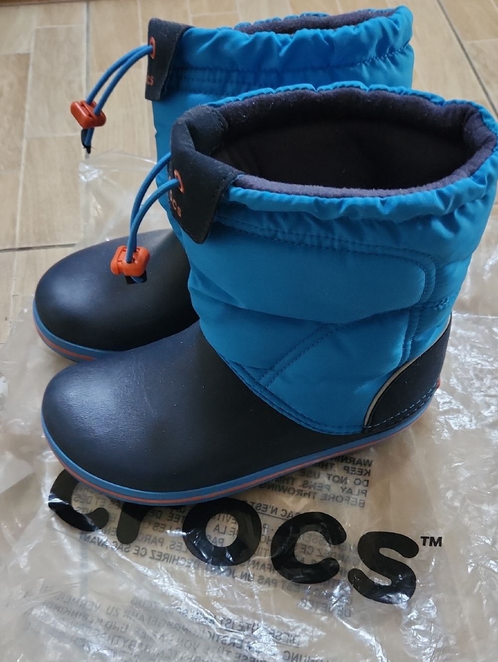 CROCS Kids Blue and Black Waterproof Winter Boots with Orange Accents